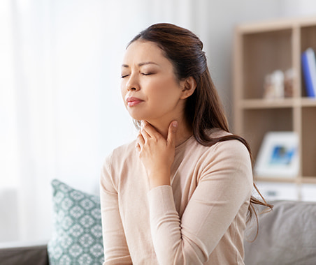 Woman Rubbing Her Neck