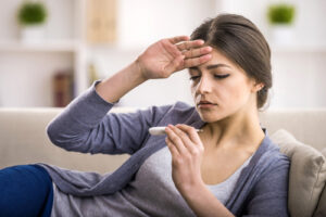 woman checking her temperature