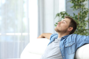 man sitting on couch